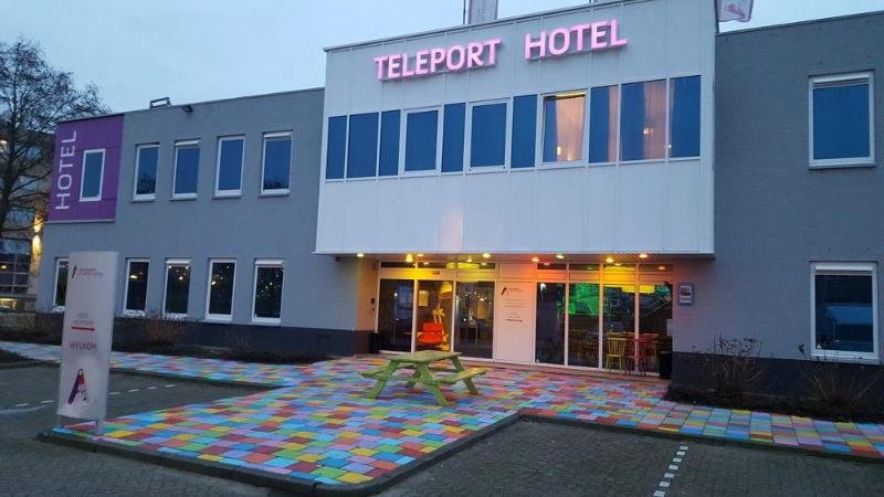 Teleport Hotel Amsterdam exterior view with colorful pavement and modern design