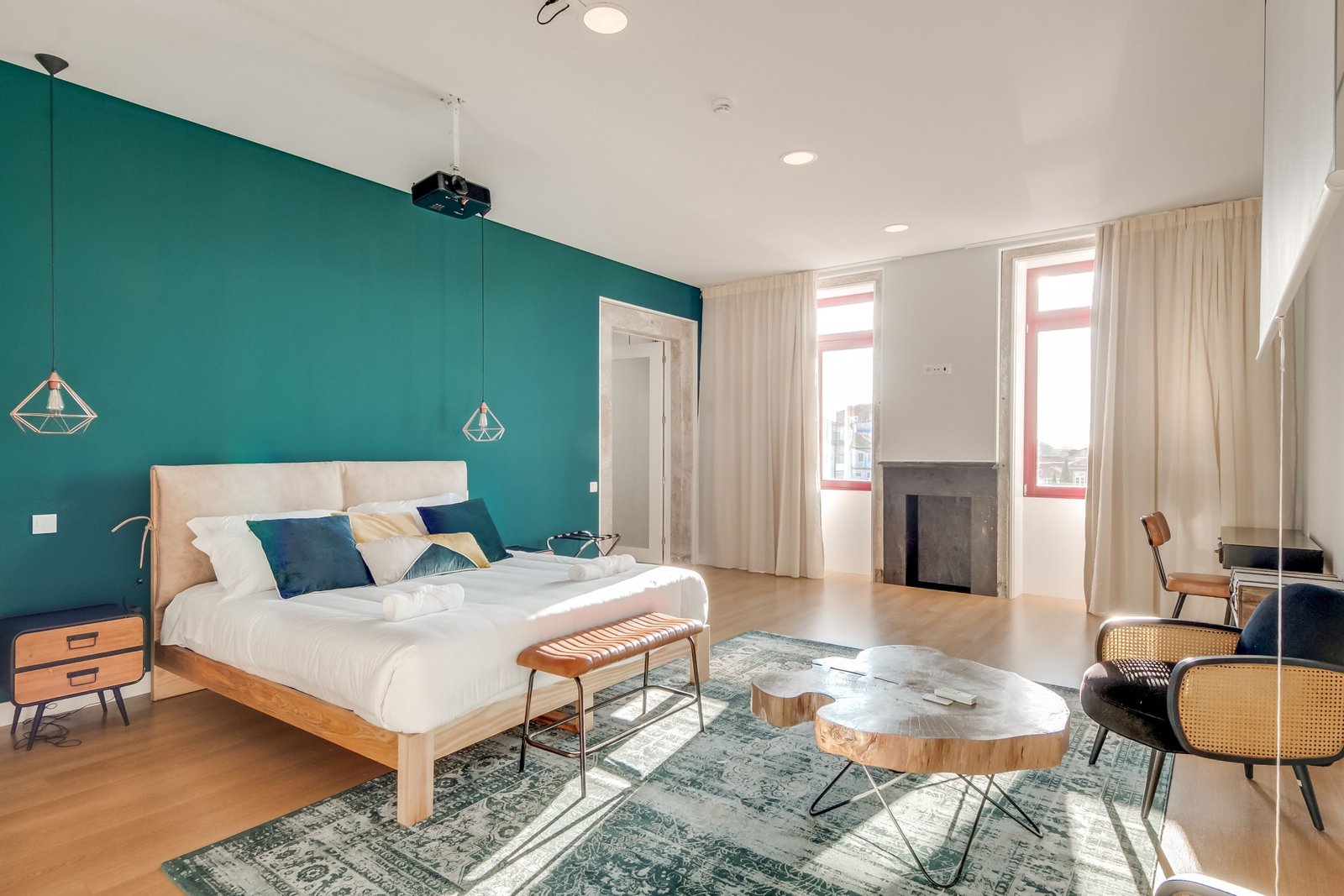 Luxury boutique hotel room at Selina Porto with modern decor, elegant furnishings, and natural lighting.