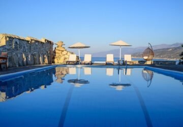 Swimming pool with sea views at Cavos Bay Hotel and Studios in Ikaria, Greece
