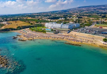 Aerial view of Corallia Beach Hotel in Paphos, Cyprus, located directly on the beach