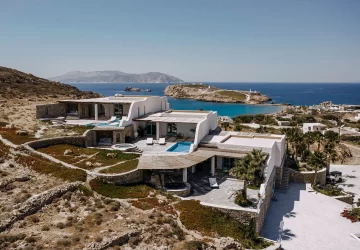 Panoramic view of Agalia Luxury Suites in Ios, Greece, featuring modern architecture and sea views